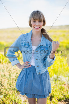 Smiling trendy young woman posing