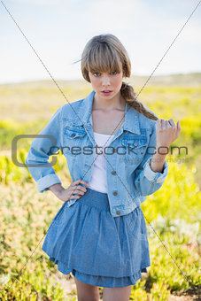Mysterious trendy young woman posing