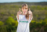Natural blonde wearing a volunteering t shirt giving thumbs up