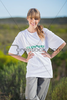 Cheerful natural blonde wearing a volunteering t shirt