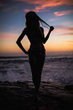 Shadow of sexy woman on sea background