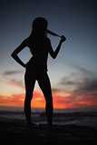 Silhouette of attractive woman on sea background