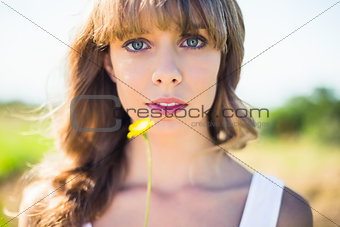 Pretty natural blonde holding dandelion