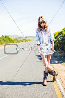 Trendy attractive blonde at the roadside