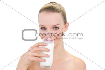 Peaceful pretty blonde model drinking milk