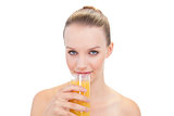 Natural pretty blonde model drinking orange juice