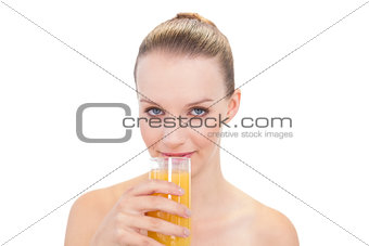 Natural pretty blonde model drinking orange juice