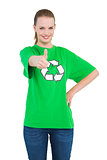 Joyful pretty environmental activist giving a thumb up