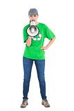 Motivated pretty environmental activist yelling in a megaphone