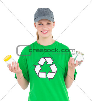 Dynamic pretty environmental activist holding two jars