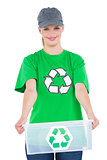 Pleased environmental activist holding a recycling box