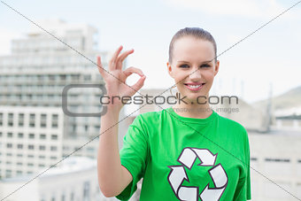 Natural pretty environmental activist making okay gesture