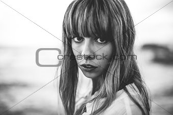 Vulnerable model with fringe staring at camera
