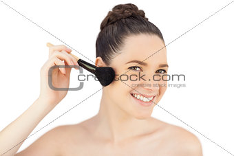 Sensual model using blusher brush
