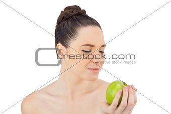 Peaceful pretty model holding apple