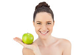 Smiling pretty model holding apple