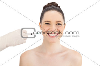Cheerful natural model having injection around the mouth