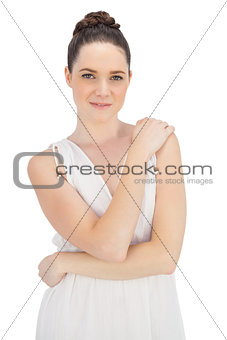 Pretty natural model in white dress posing