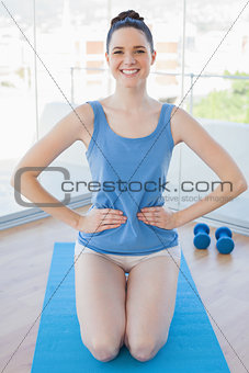 Cheerful sporty woman exercising