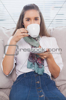 Young pretty model drinking coffee