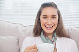 Smiling cute model holding coffee