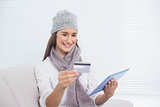 Pretty brunette with winter hat on buying online