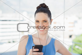 Attractive slender woman listening to music