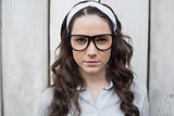 Serious trendy woman with stylish glasses posing
