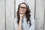Thoughtful trendy woman with stylish glasses posing