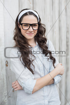 Peaceful trendy woman with stylish glasses posing