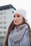 Thoughtful gorgeous woman with winter clothes on posing