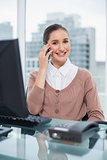 Smiling beautiful businesswoman on the phone
