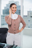 Cheerful classy businesswoman on the phone
