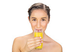 Gorgeous model drinking orange juice