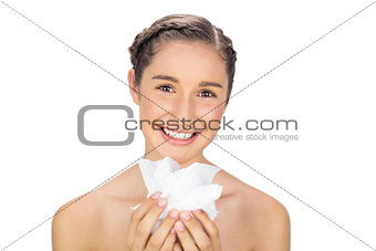 Smiling young model holding loads of tissues