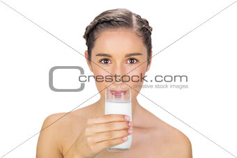 Pretty young model drinking milk