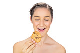 Greedy young model holding cookie
