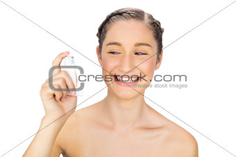 Cheerful young model holding asthma atomizer
