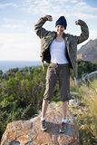Woman hiking and showing her strength