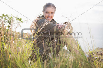 Woman sitting in grass
