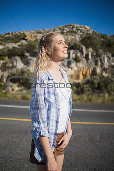 Woman looking up and enjoying the sun