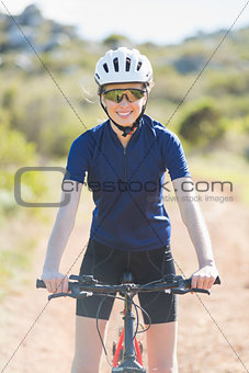 Woman wearing helmet on her bike