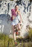 Blonde woman with climbing equipment