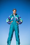 Woman in ski suit with hands on hips