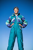 Woman wearing ski suit with closed eyes