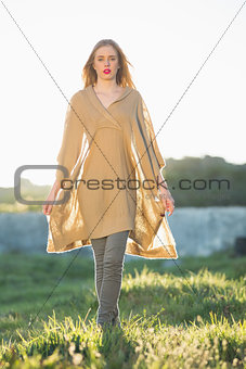 Attractive blonde woman wearing poncho