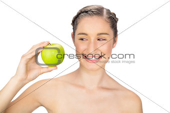 Smiling healthy model holding green apple