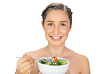 Smiling natural model holding healthy salad