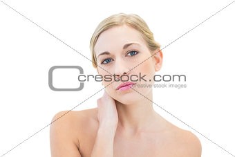 Attractive young blonde woman looking at camera