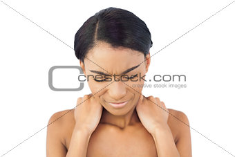 Cute woman suffering from painful neck